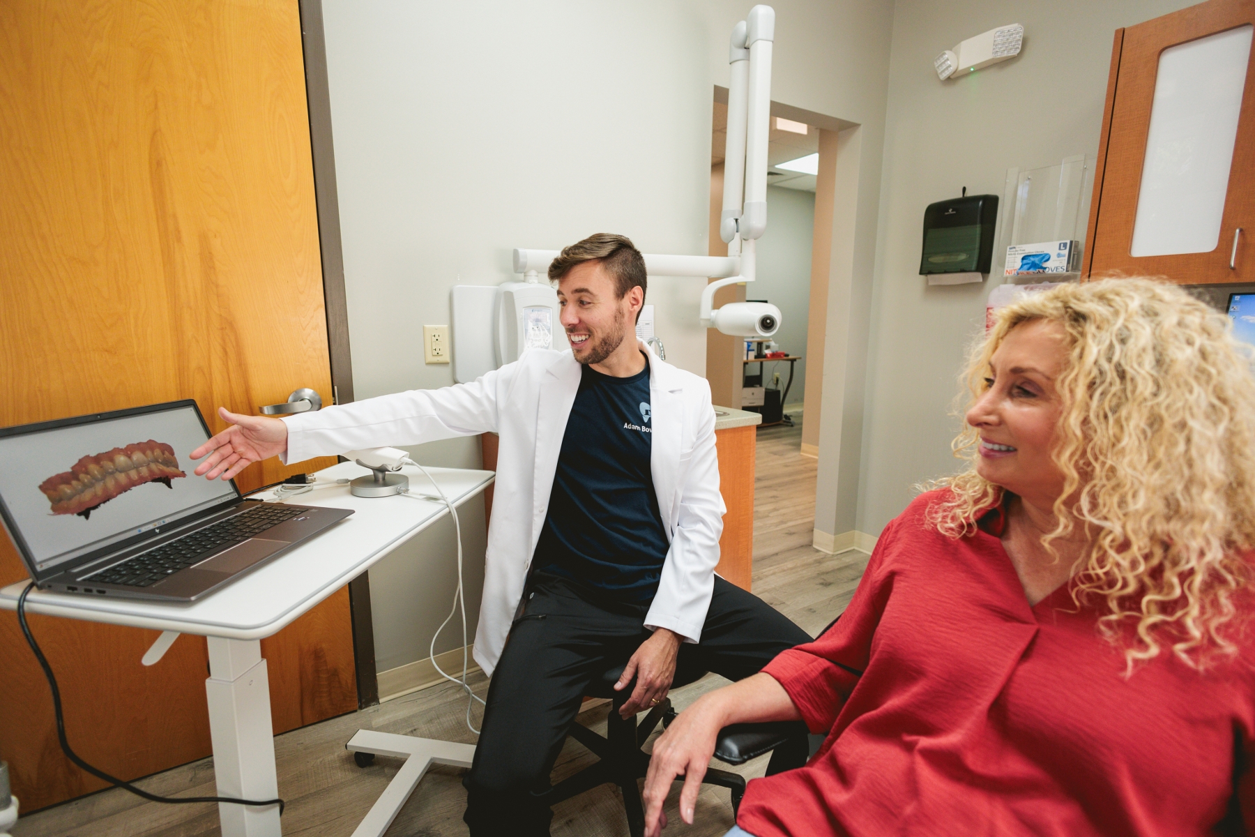 Dr. Bowers explaining scan to patient